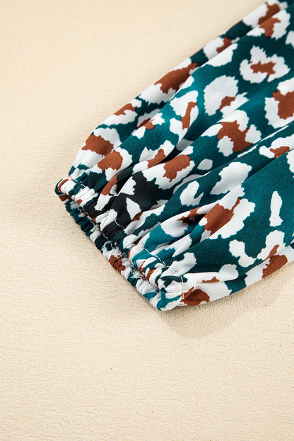 Blauwe overhemdjurk met ruches en luipaardprint met bubbelmouwen