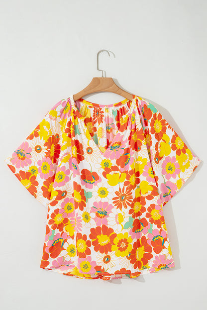 Oranje blouse met abstracte print en V-hals en halve mouw