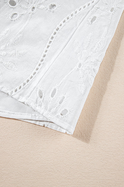 Witte tanktop met geknoopte bandjes en V-hals met borduurmotief