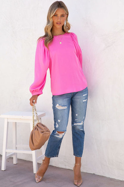 Roze satijnen blouse met ronde hals en lange mouwen