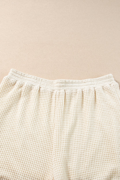 Beige korte tweedelige set met franjes en getextureerde rand