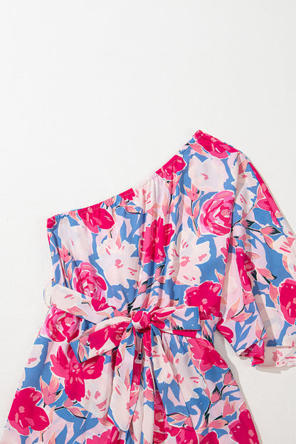Roze bloemenprint asymmetrische halslijn enkele schouder drape mouw riem jumpsuit