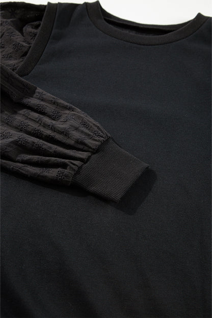 Zwart getextureerd sweatshirt met ronde hals en patchwork