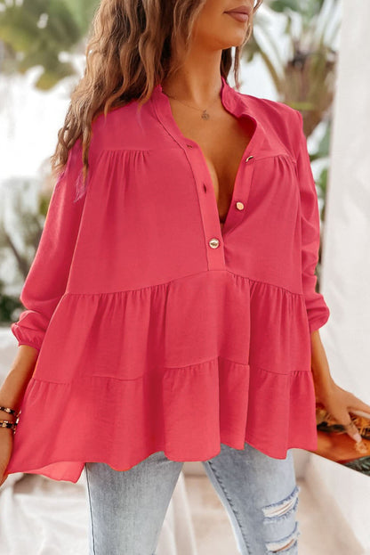 Roze blouse met halfgeknoopte ruches en gelaagde lange mouwen