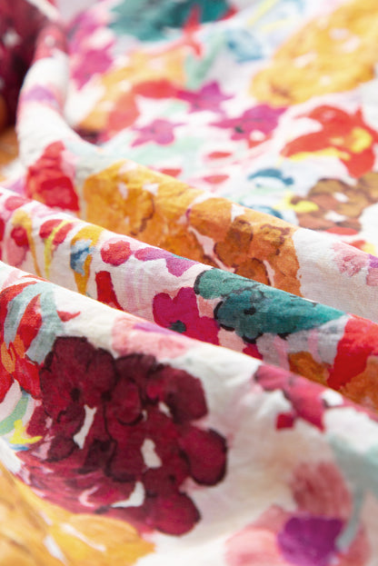 Paarse bloemenprint jurk met splitnek en fladdermouwen