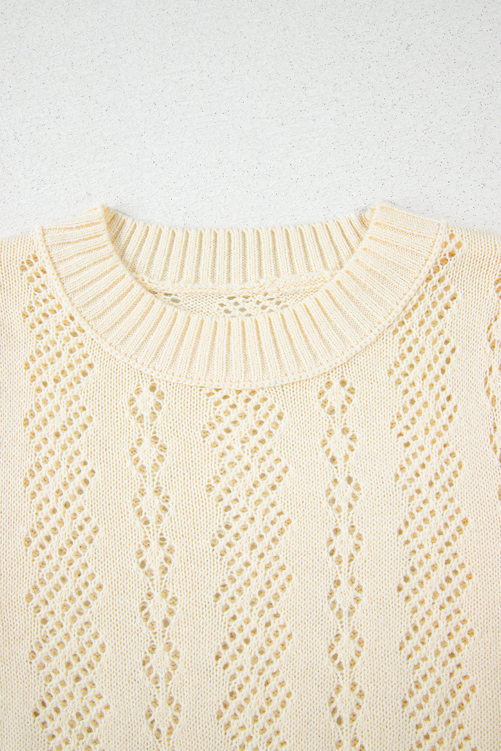 Beige uitgehold patroon gebreide korte puff mouw trui