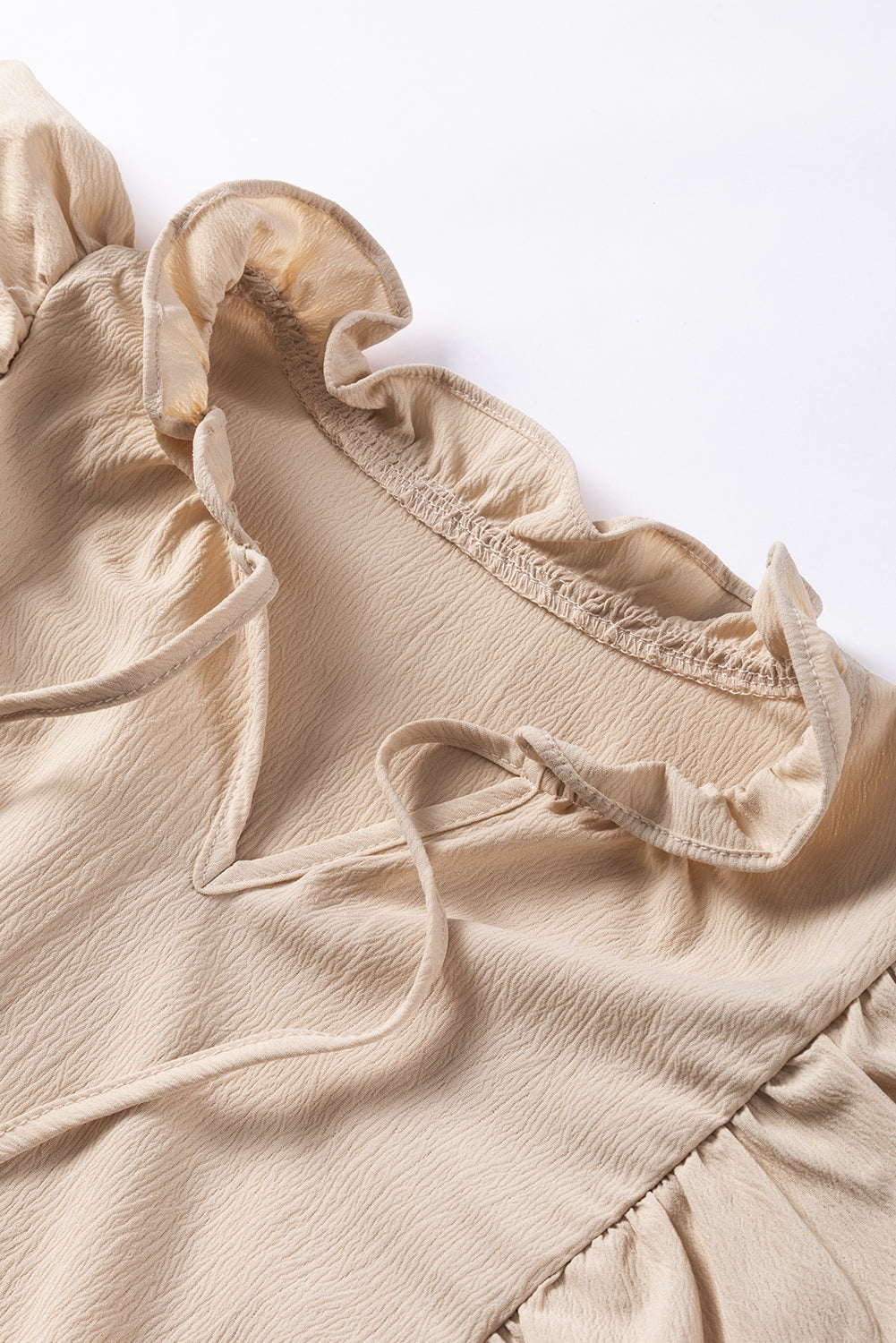 Kaki blouse met ruches en bubbelmouwen met veters