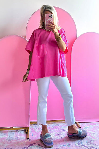 Felroze oversized T-shirt met opgestikte zak en zichtbare naad