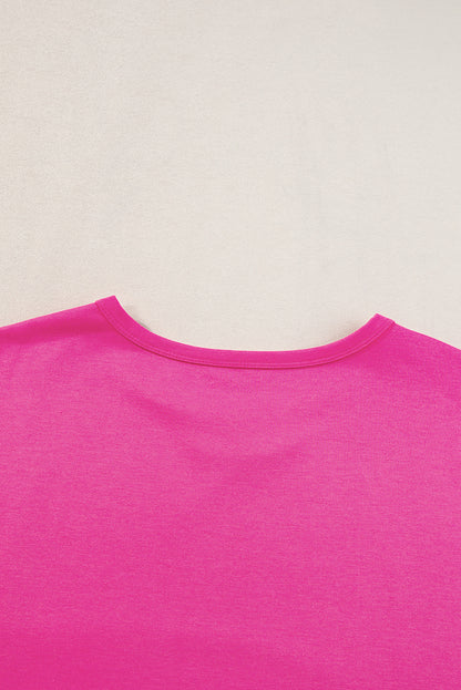 Felroze oversized T-shirt met opgestikte zak en zichtbare naad