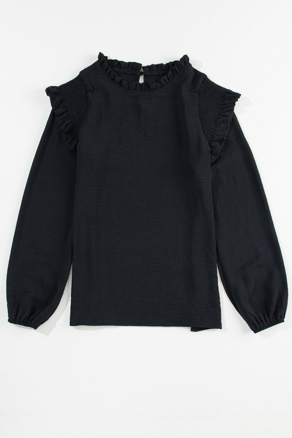 Zwarte blouse met ruches en ruches en bubbelmouwen