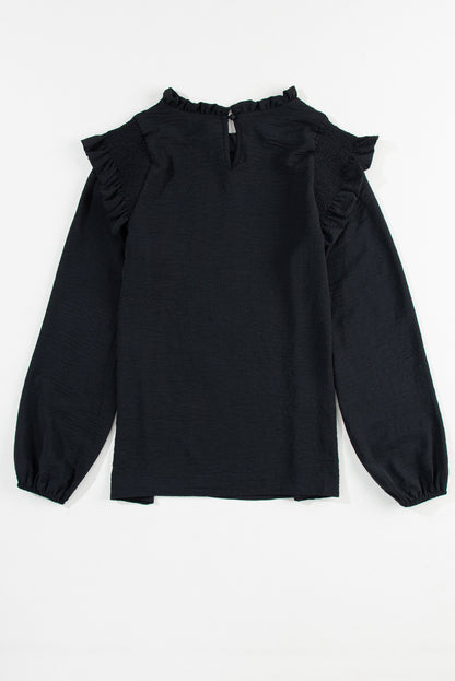 Zwarte blouse met ruches en ruches en bubbelmouwen