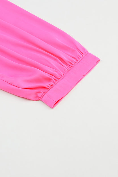 Roze satijnen blouse met ronde hals en lange mouwen