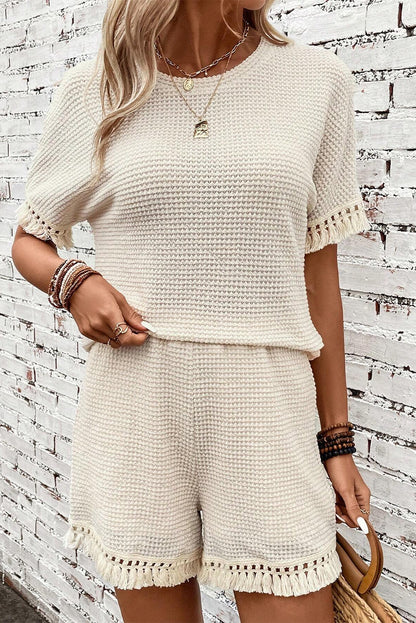 Beige korte tweedelige set met franjes en getextureerde rand