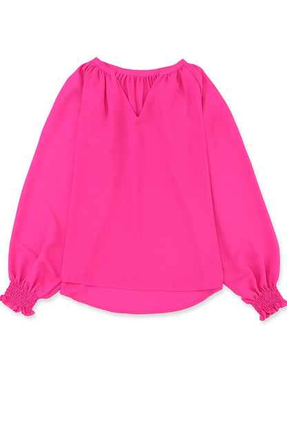 Roze geplooide blouse met V-hals en gezwollen mouwen