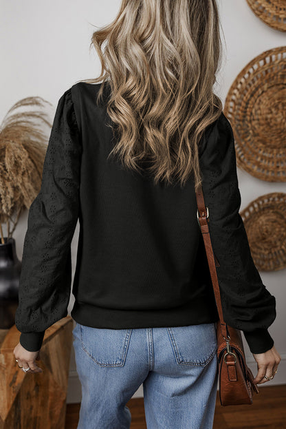 Zwart getextureerd sweatshirt met ronde hals en patchwork