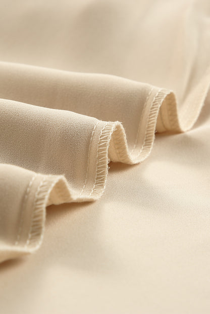 Beige blouse met gespleten hals en luipaardmesh met bubbelmouwen