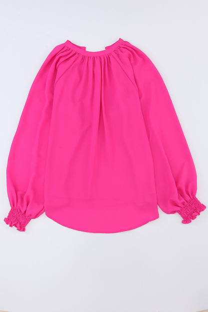 Roze geplooide blouse met V-hals en gezwollen mouwen