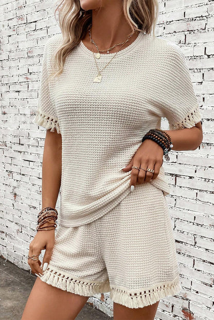 Beige korte tweedelige set met franjes en getextureerde rand