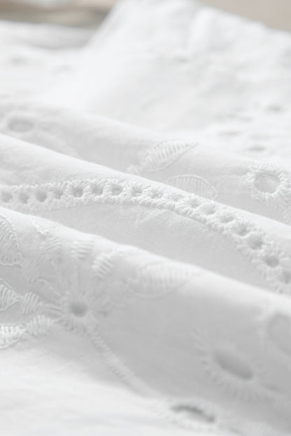 Witte tanktop met geknoopte bandjes en V-hals met borduurmotief