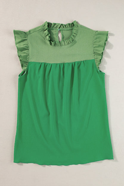 Heldergroene tweekleurige blouse met ruches en fladdermouwen