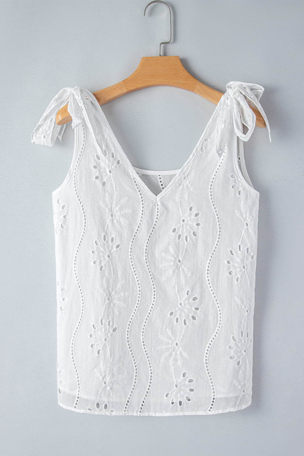 Witte tanktop met geknoopte bandjes en V-hals met borduurmotief