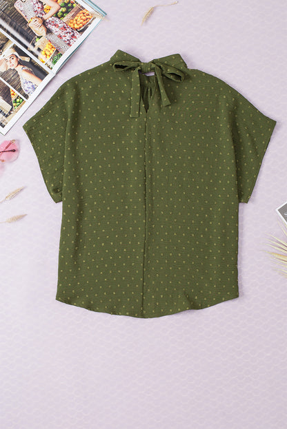 Mistgroene blouse met Zwitserse stippen en vleermuismouwen