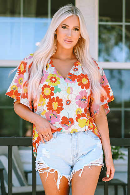 Oranje blouse met abstracte print en V-hals en halve mouw