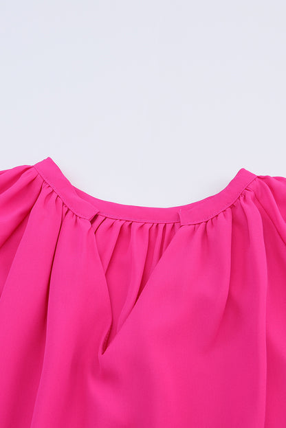 Roze geplooide blouse met V-hals en gezwollen mouwen