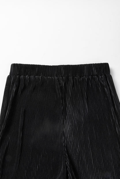 Zwarte cropped trui met koord en broek met wijde pijpen