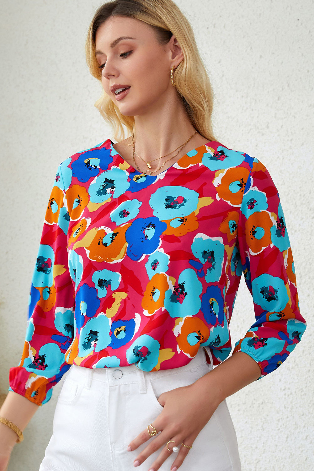 Roze veelkleurige blouse met V-hals en 3/4 mouwen met bloemenprint