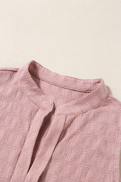 Roze tanktop met splithals en traliestructuur