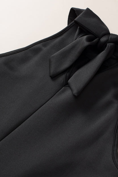 Zwarte tanktop met sleutelgat en lovertjes op de rug