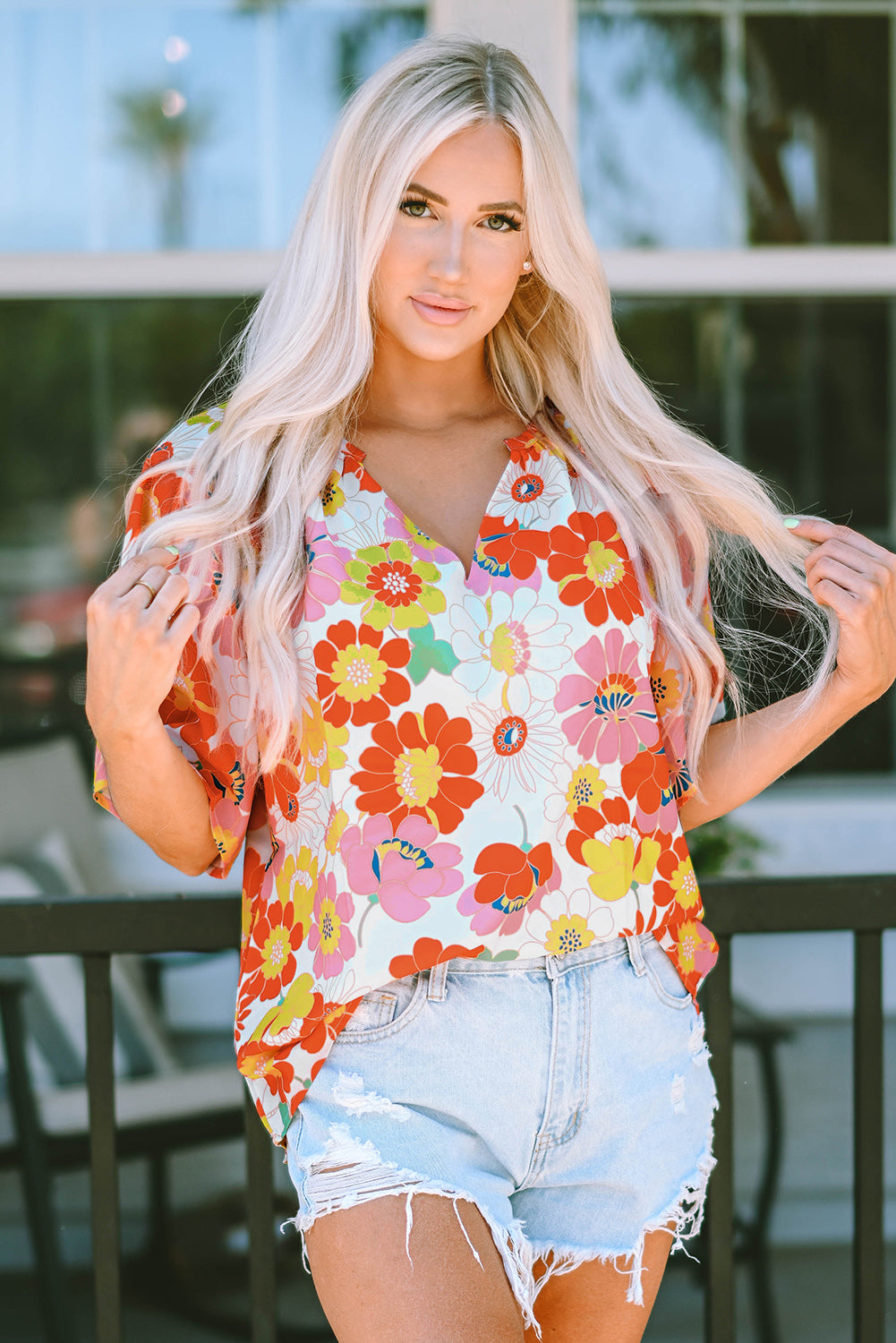 Oranje blouse met abstracte print en V-hals en halve mouw