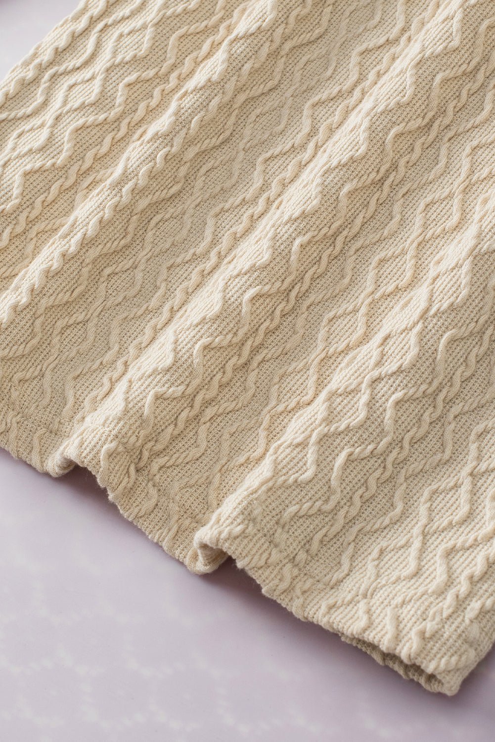 Abrikoos vintage getextureerde top met pofmouwen en nephals