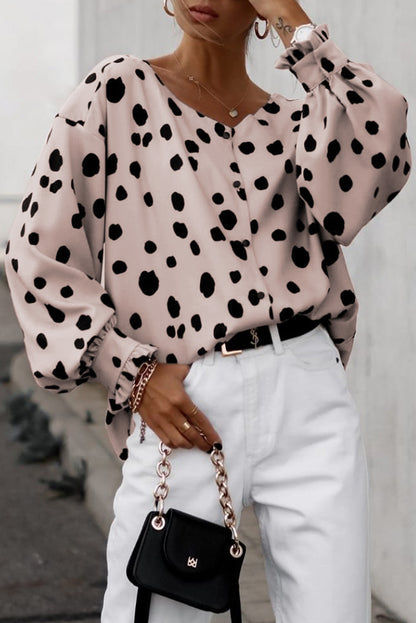 Oversized blouse met roze knopen en ruches aan de manchetten