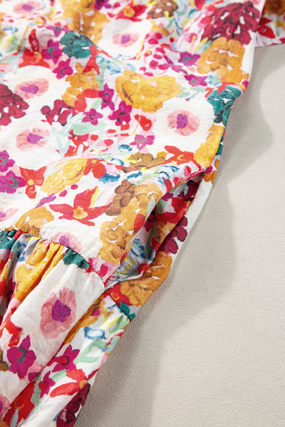 Paarse bloemenprint jurk met splitnek en fladdermouwen