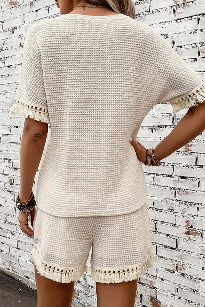 Beige korte tweedelige set met franjes en getextureerde rand