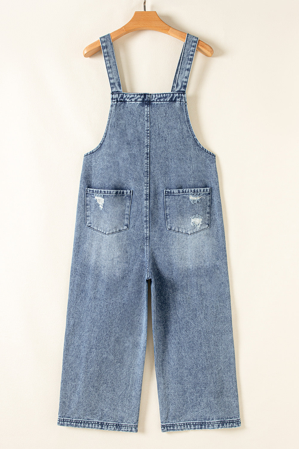 Steenblauwe bedroefde slabbetje zak wijd been denim in het algemeen