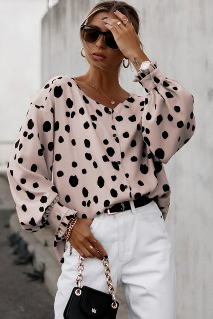 Oversized blouse met roze knopen en ruches aan de manchetten