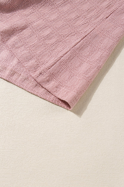 Roze tanktop met splithals en traliestructuur