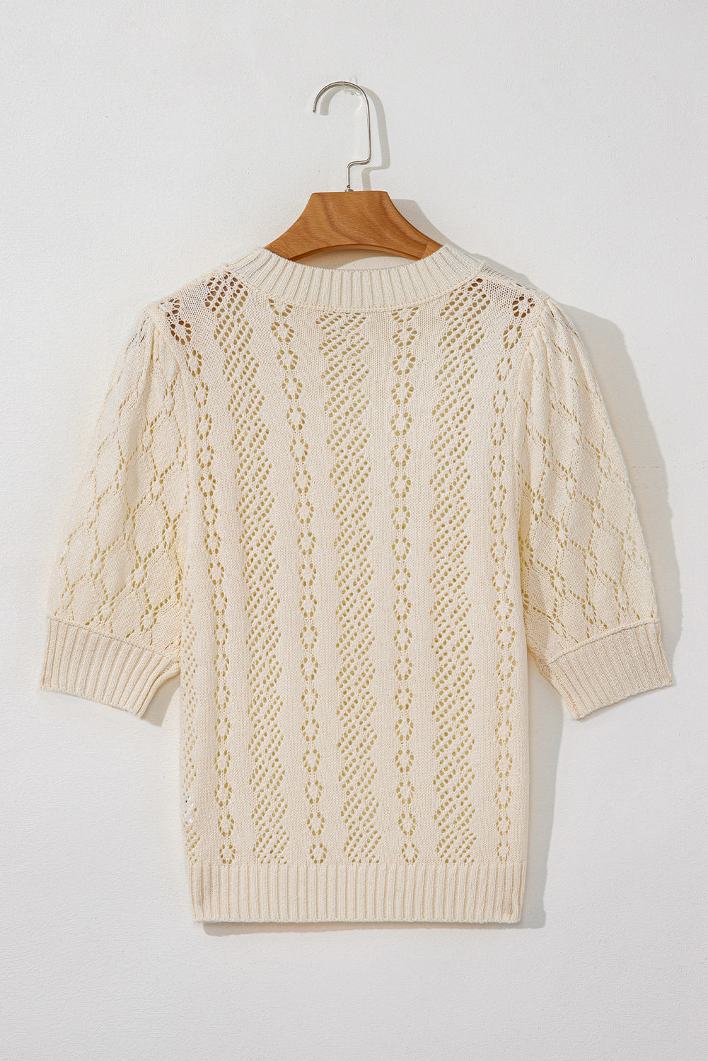 Beige uitgehold patroon gebreide korte puff mouw trui