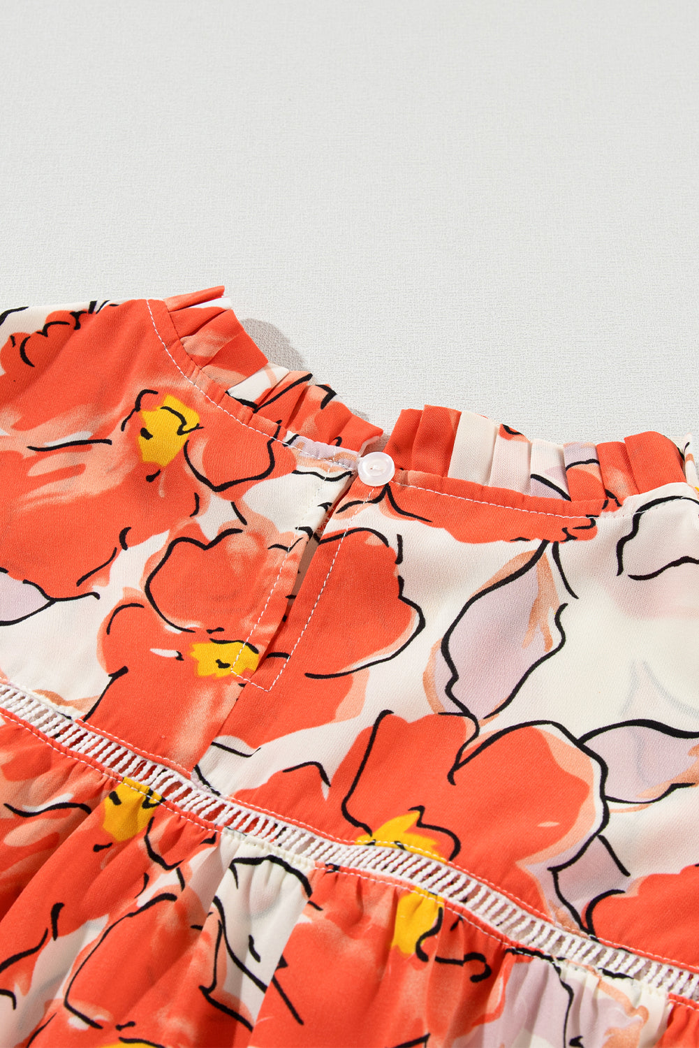 Oranje bloemen losse blouse met bubbelmouwen en ruches aan de hals