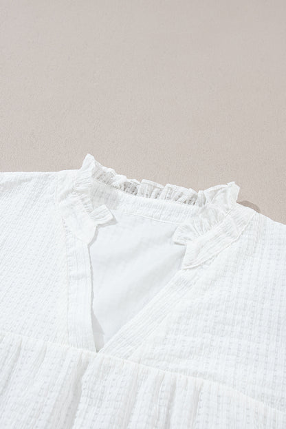 Witte bloemen geborduurde blouse met pofmouwen en ingekeepte hals