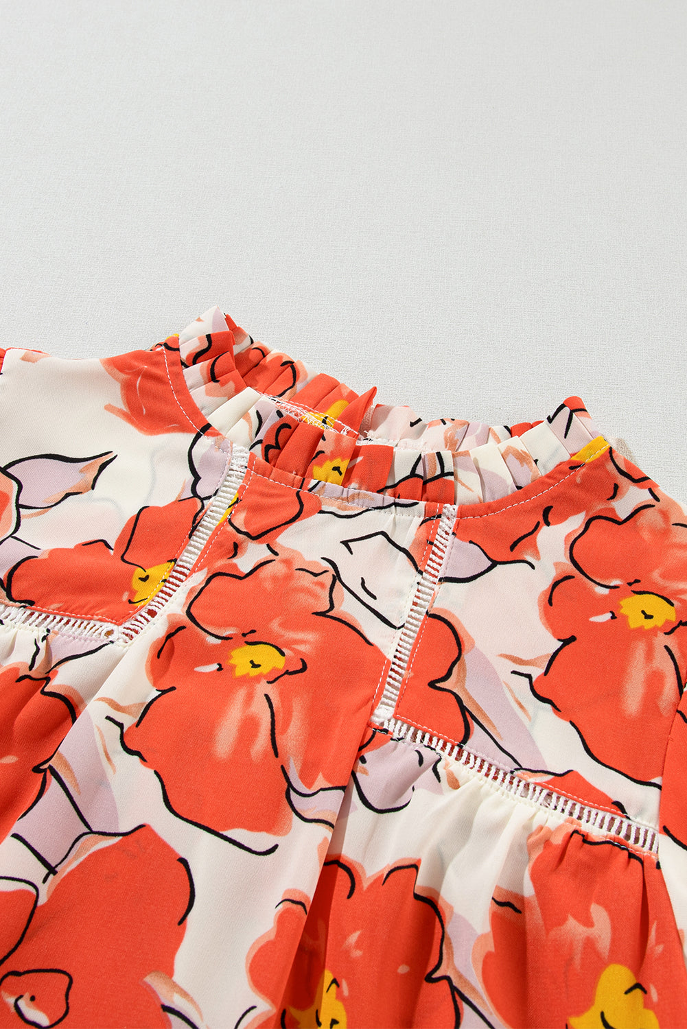 Oranje bloemen losse blouse met bubbelmouwen en ruches aan de hals