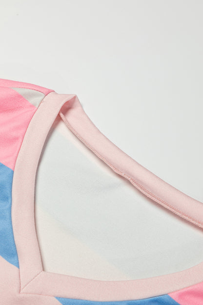 Roze contrasterende gestreepte top met V-hals en lange mouwen