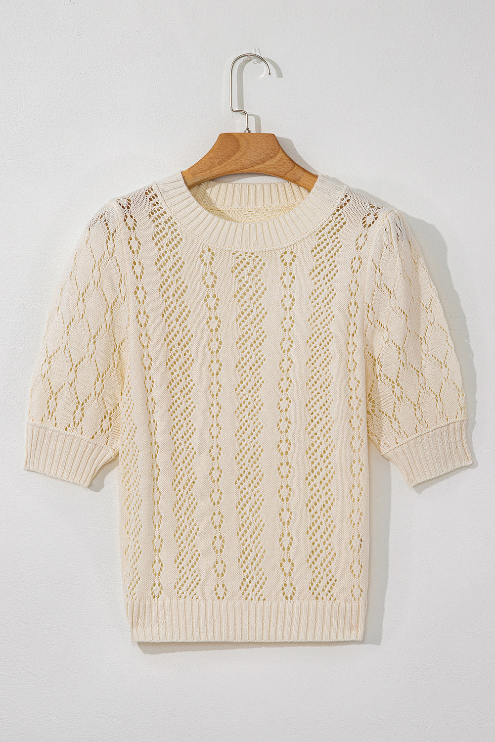 Beige uitgehold patroon gebreide korte puff mouw trui