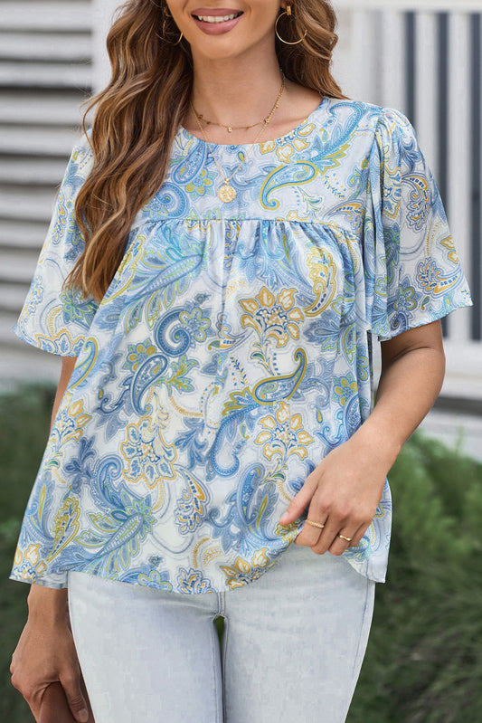 Hemelsblauwe losse blouse met paisleyprint en wijde mouwen