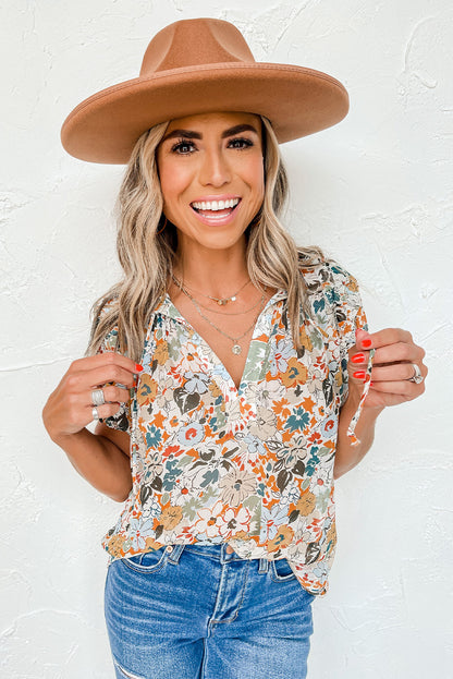 Veelkleurige blouse met split en V-hals, pofmouwen en bloemenprint