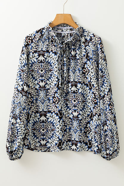 Blauwe tribale afdruk vaarten met fronvilde nek puff mouw blouse