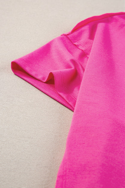 Felroze oversized T-shirt met opgestikte zak en zichtbare naad